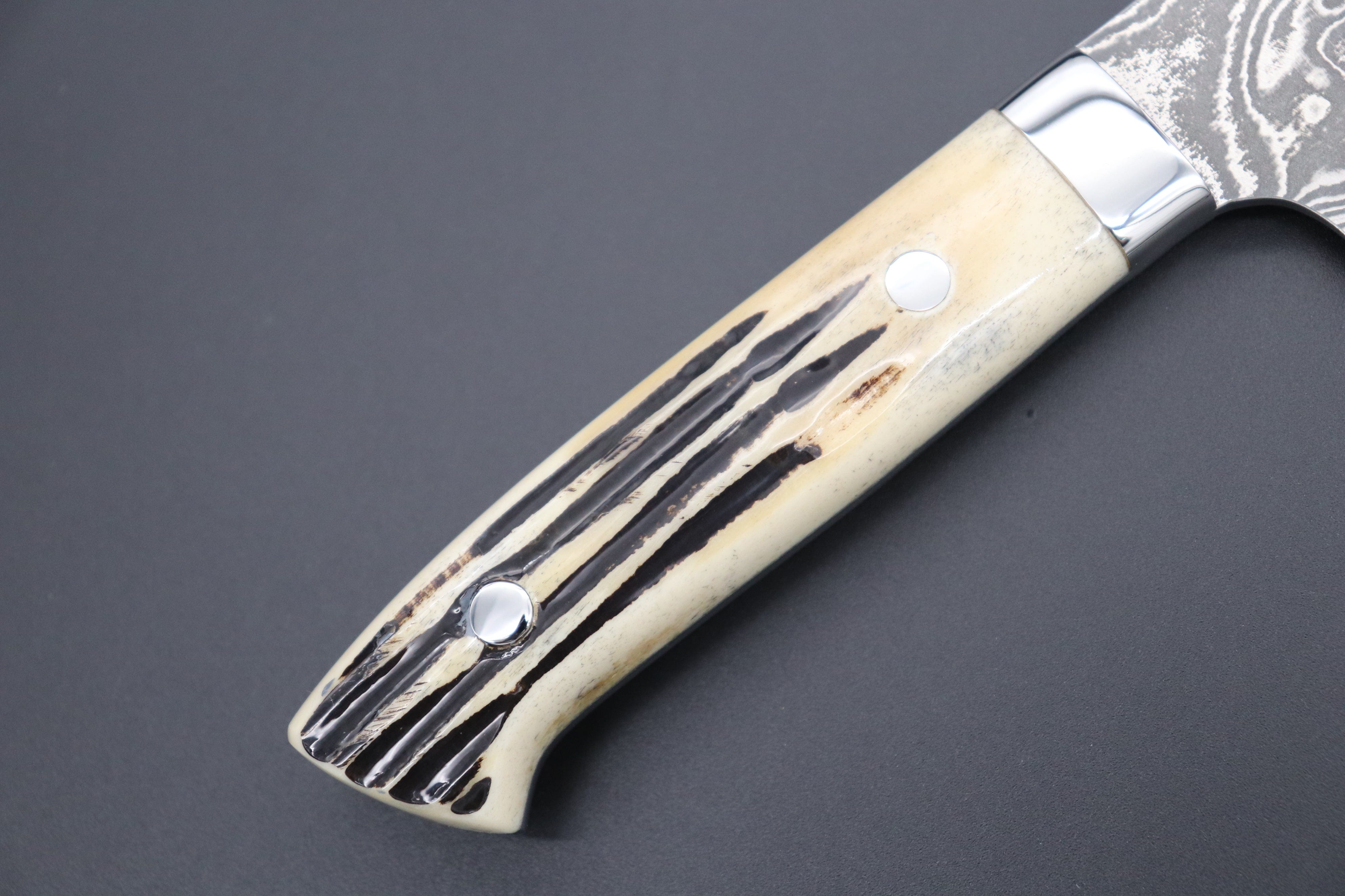 https://japanesechefsknife.com/cdn/shop/files/takeshi-saji-gyuto-takeshi-saji-r-2-custom-black-damascus-wild-series-gyuto-180mm-to-270mm-4-sizes-stag-bone-handle-42516309082395.jpg?v=1693193085