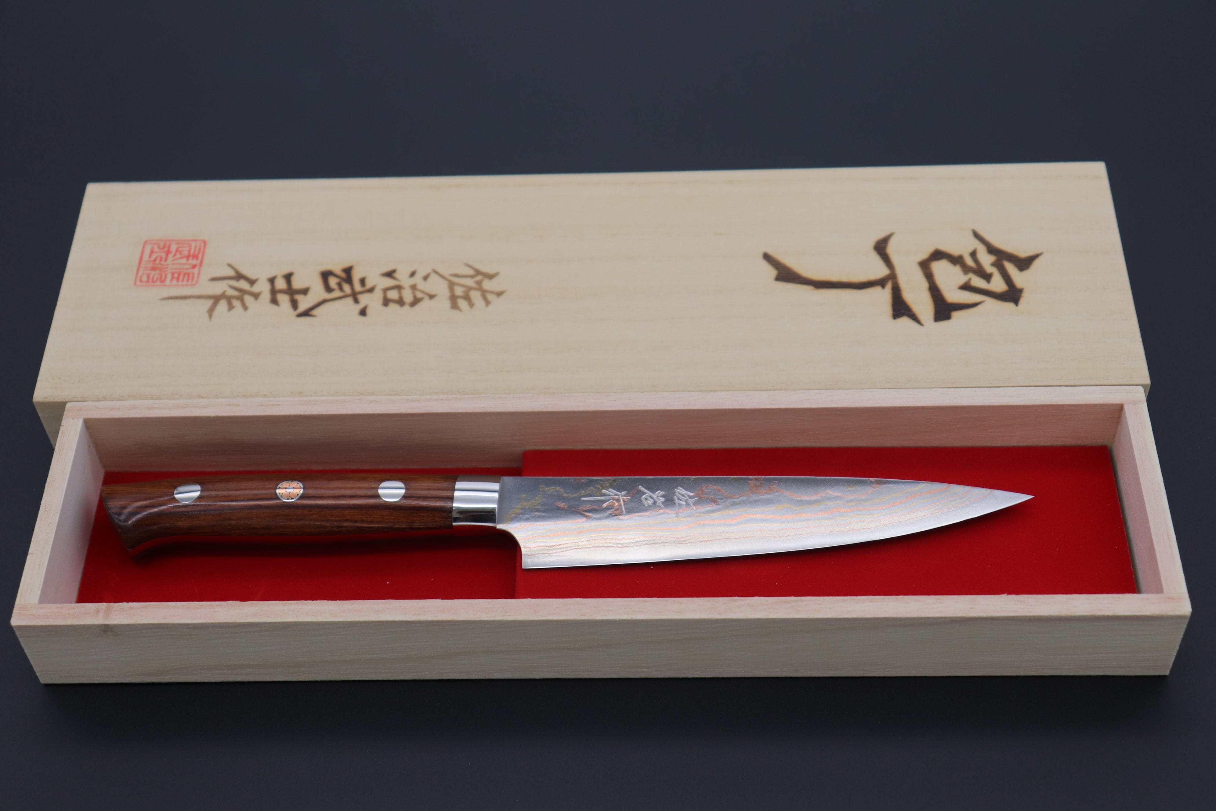 https://japanesechefsknife.com/cdn/shop/files/takeshi-saji-petty-master-saji-rainbow-damascus-series-petty-135mm-and-150mm-ironwood-handle-42212100636955.jpg?v=1690943812