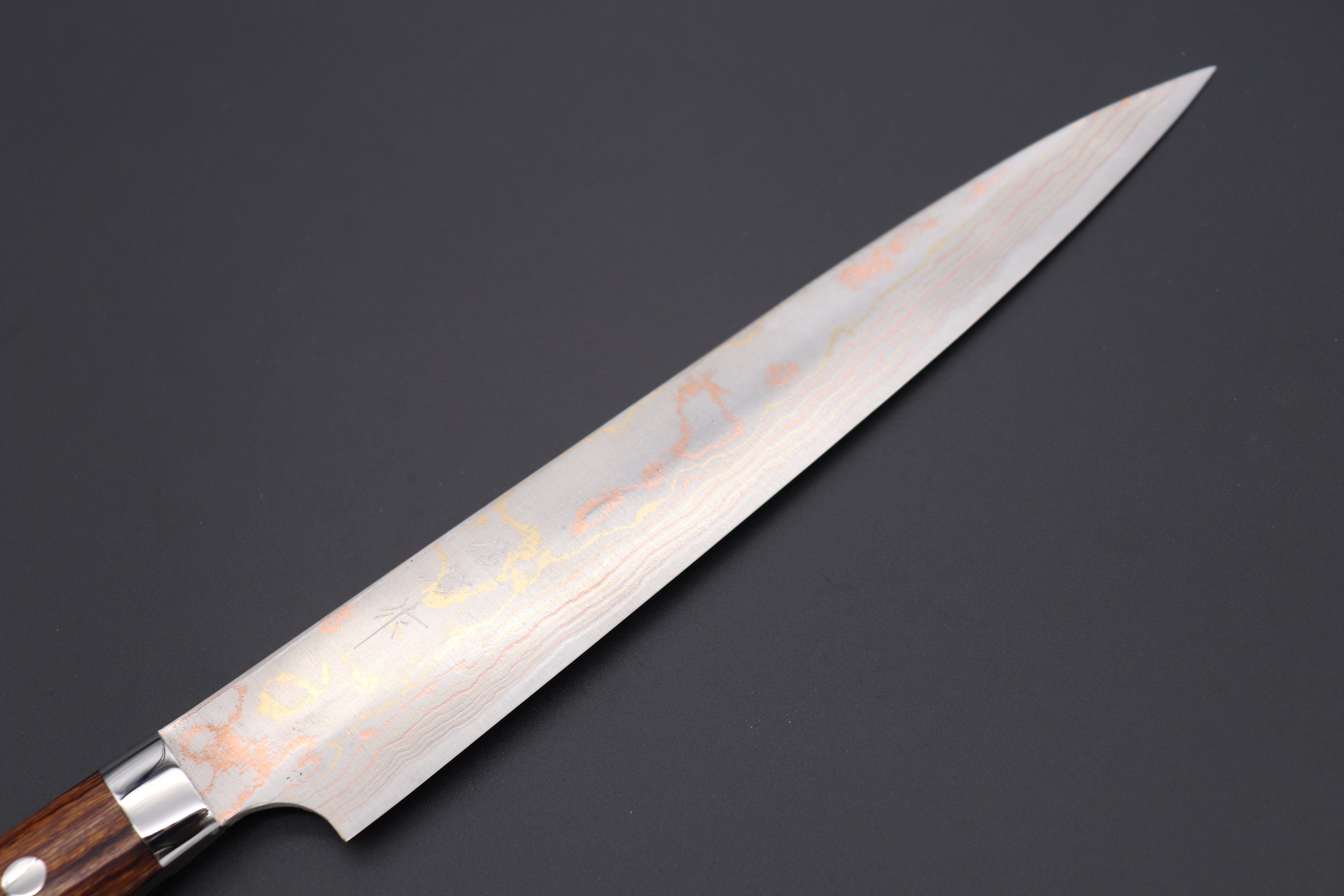 https://japanesechefsknife.com/cdn/shop/files/takeshi-saji-sujihiki-master-saji-rainbow-damascus-series-sujihiki-240mm-270mm-2-sizes-ironwood-handle-42212056662299.jpg?v=1690943086