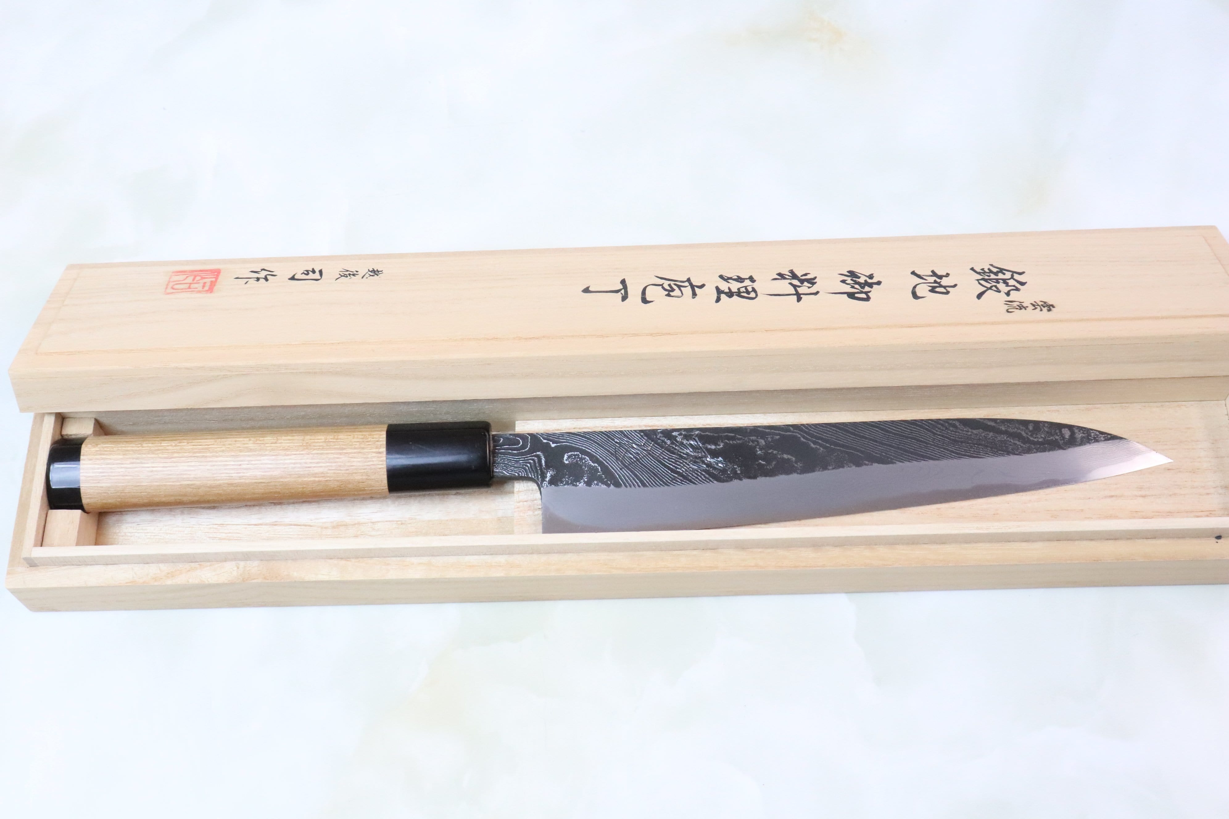 https://japanesechefsknife.com/cdn/shop/products/hinoura-wa-petty-tsukasa-hinoura-custom-knife-unryu-mon-th-11-wa-petty-195mm-7-6-inch-enjyu-wood-handle-with-water-buffalo-horn-ferrule-butt-15916467388513.jpg?v=1599482589