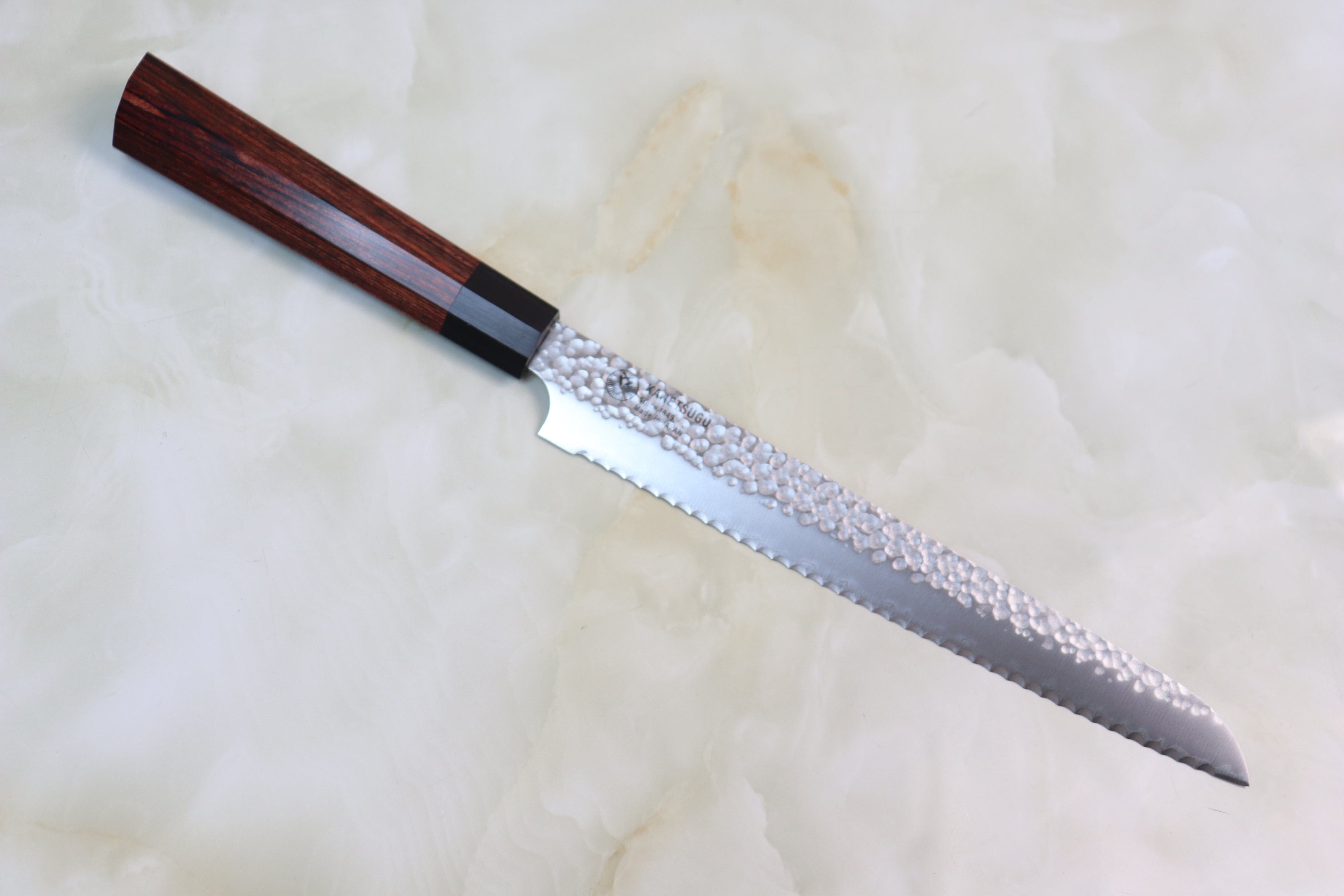 https://japanesechefsknife.com/cdn/shop/products/kanetsugu-bread-knife-kanetsugu-classic-hammered-wa-series-chw-4-bread-knife-210mm-8-2-inch-29529089835105.jpg?v=1651484374