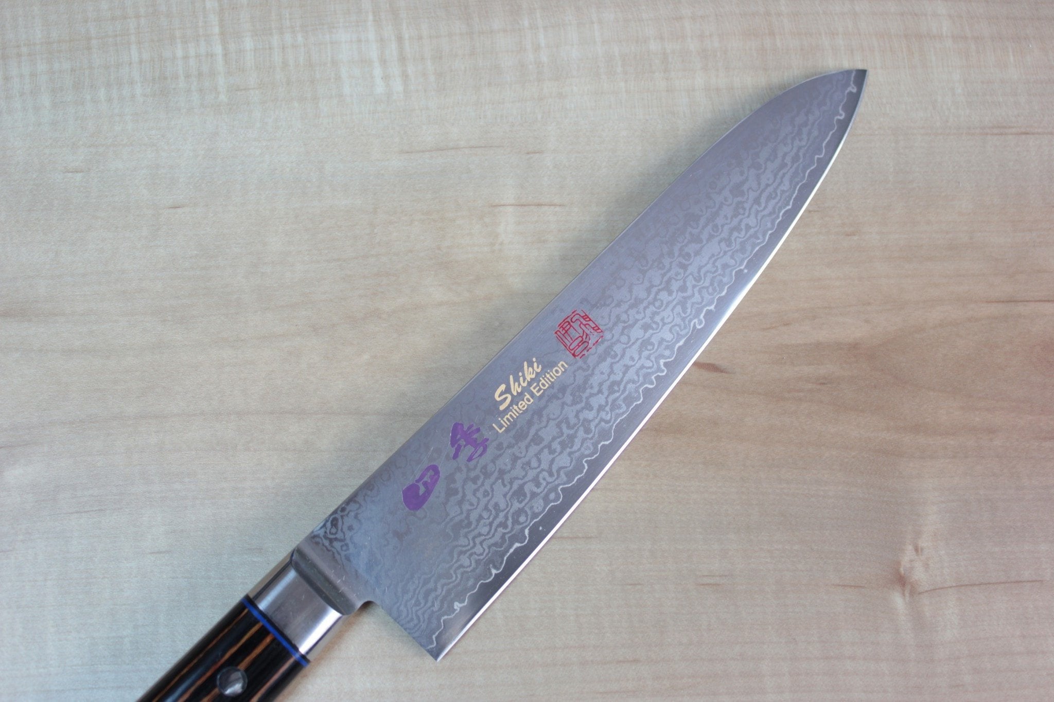https://japanesechefsknife.com/cdn/shop/products/shiki-gyuto-shiki-shikisai-series-gyuto-180mm-to-240mm-3-sizes-black-pakka-wood-handle-with-brown-stripes-21577616206.jpg?v=1574701446