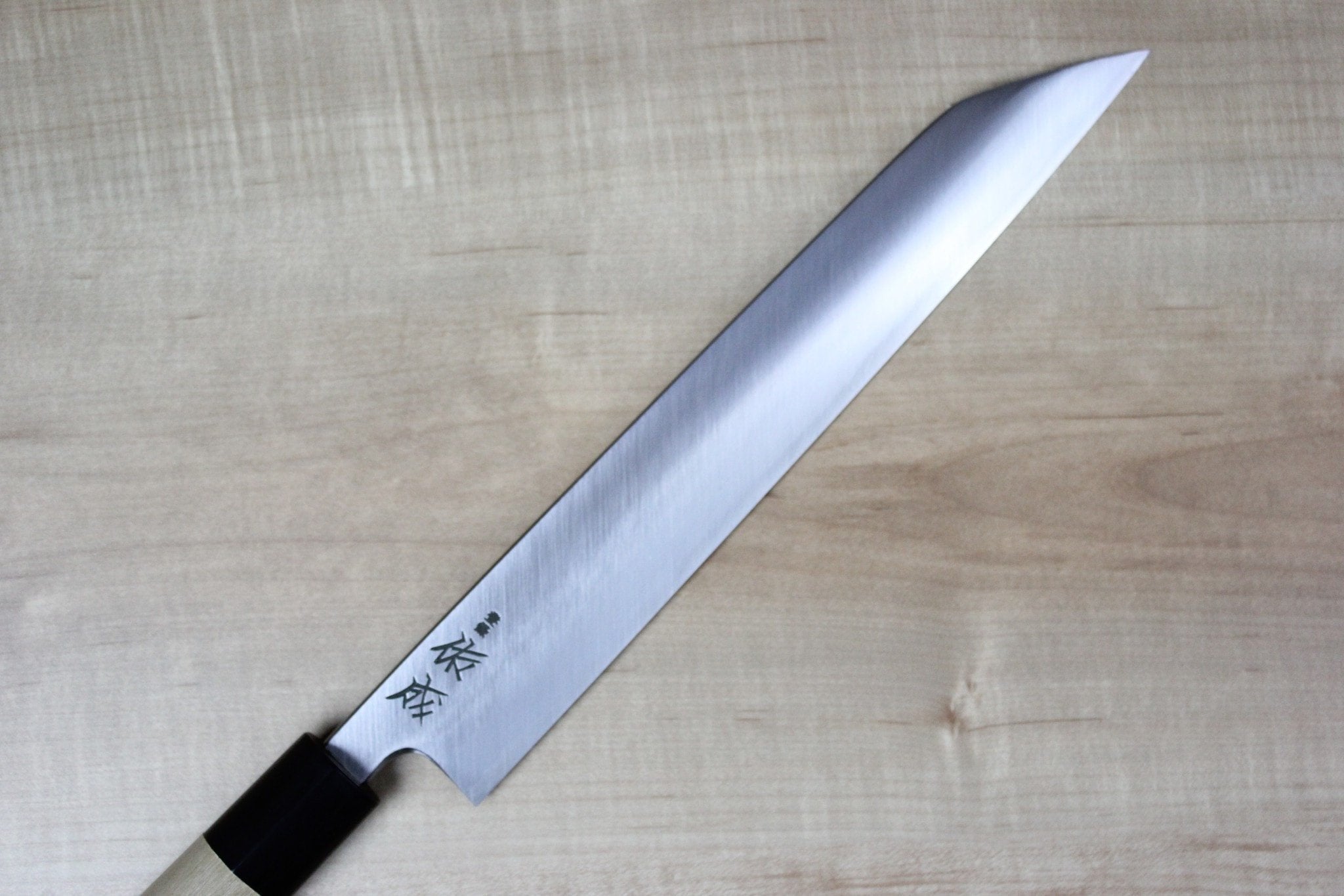 https://japanesechefsknife.com/cdn/shop/products/sukenari-kiritsuke-sukenari-hon-kasumi-white-steel-no-2-series-kiritsuke-without-shinogi-240mm-and-270mm-2-sizes-18608724227.jpg?v=1574701532
